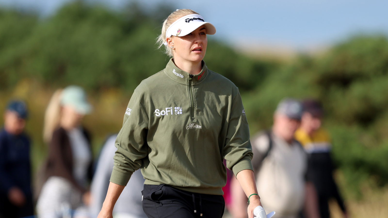 Charley Hull walks off the green