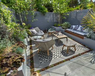 modern patio with tiled paving and plants