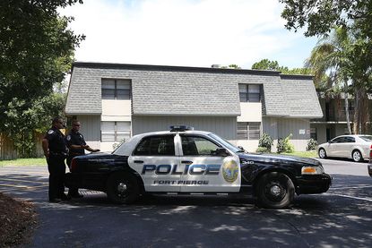 Police block the entrance to the apartment building where shooting suspect Omar Mateen is believed to have lived on June 12, 2016 in Fort Pierce, Florida. 