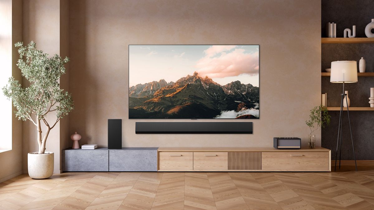 Lifestyle image of the 83-inch LG G5 OLED TV on a wall, with a soundbar mounted beneath it.