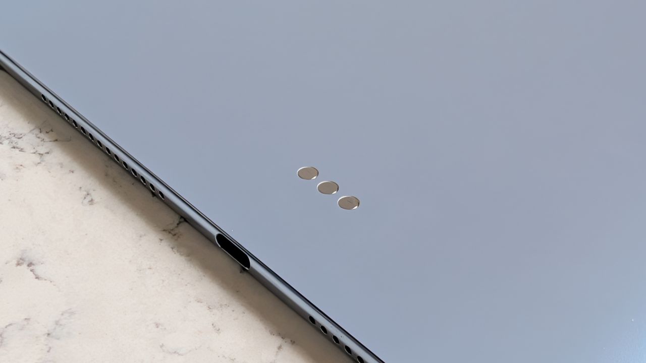 Photos of the Huawei MatePad Pro Max resting on a marble table