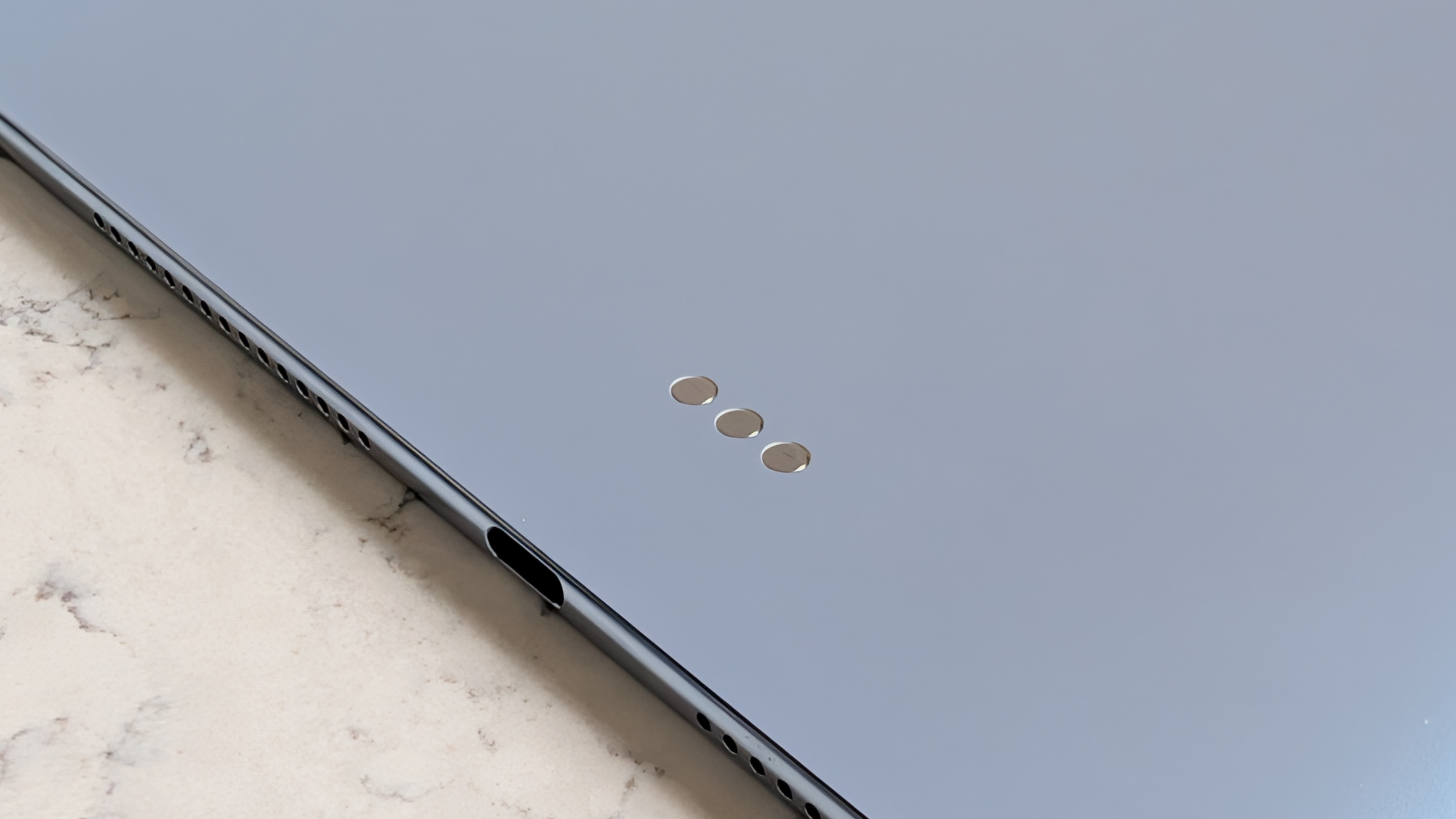 Photos of the Huawei MatePad Pro Max resting on a marble table