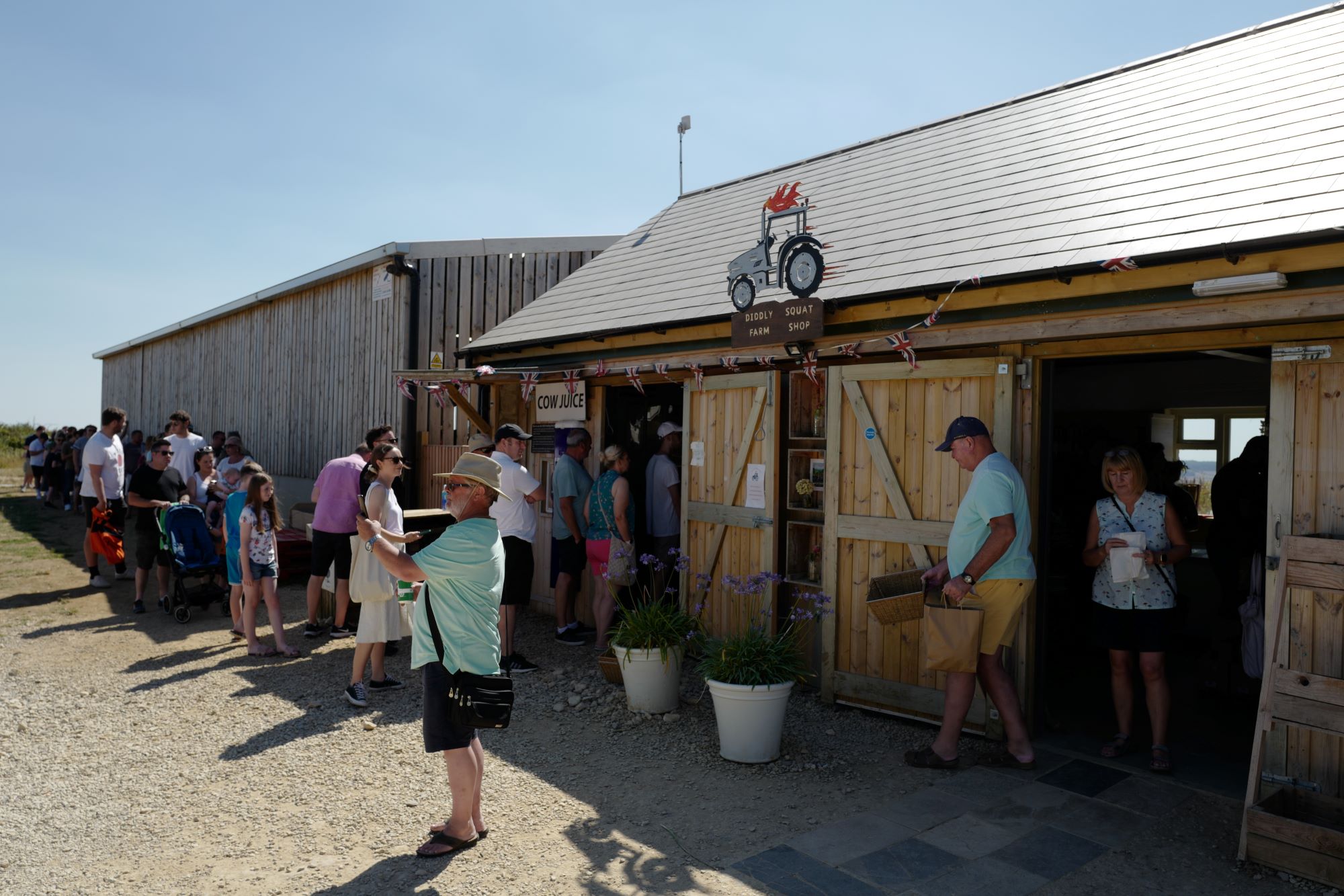 The Diddly Squat Farm Shop with a number of visitors