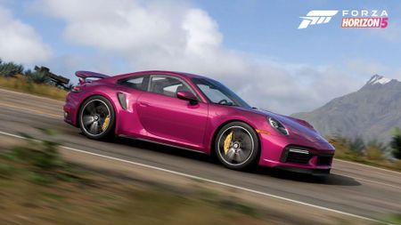 Image of a pink Porsche racing down a road in Forza Horizon 5.