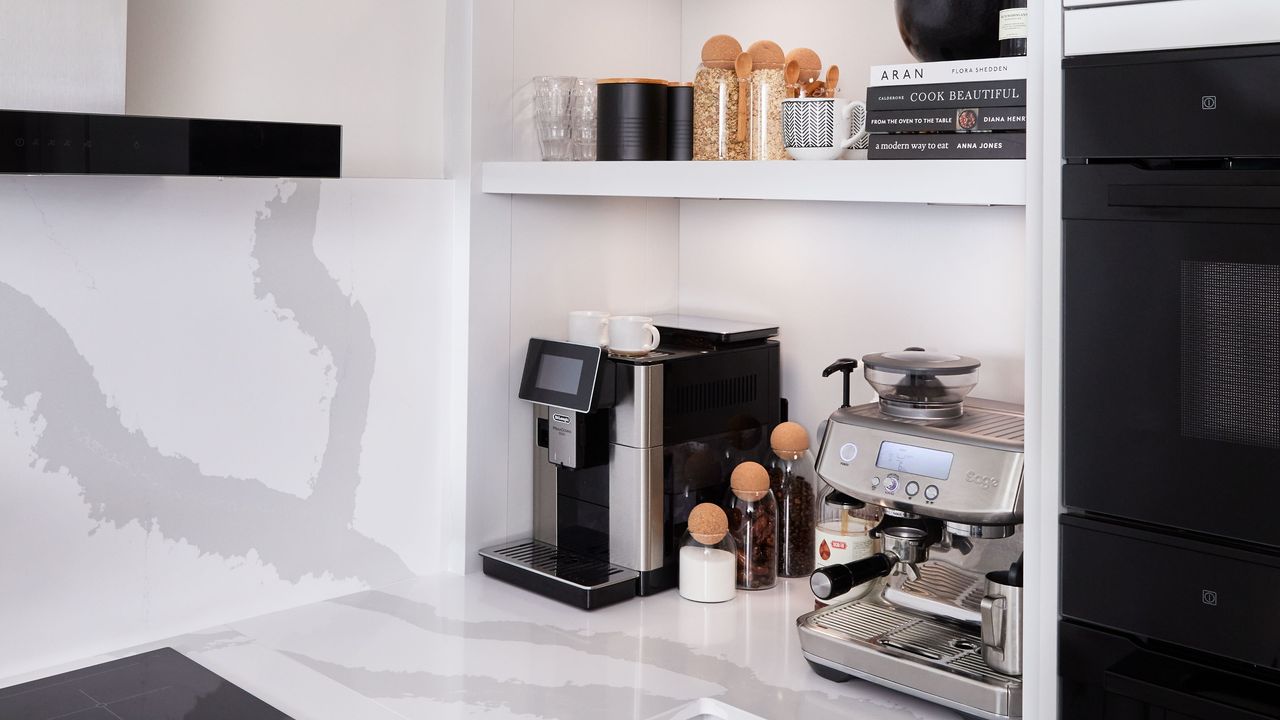 A white kitchen with a coffee station