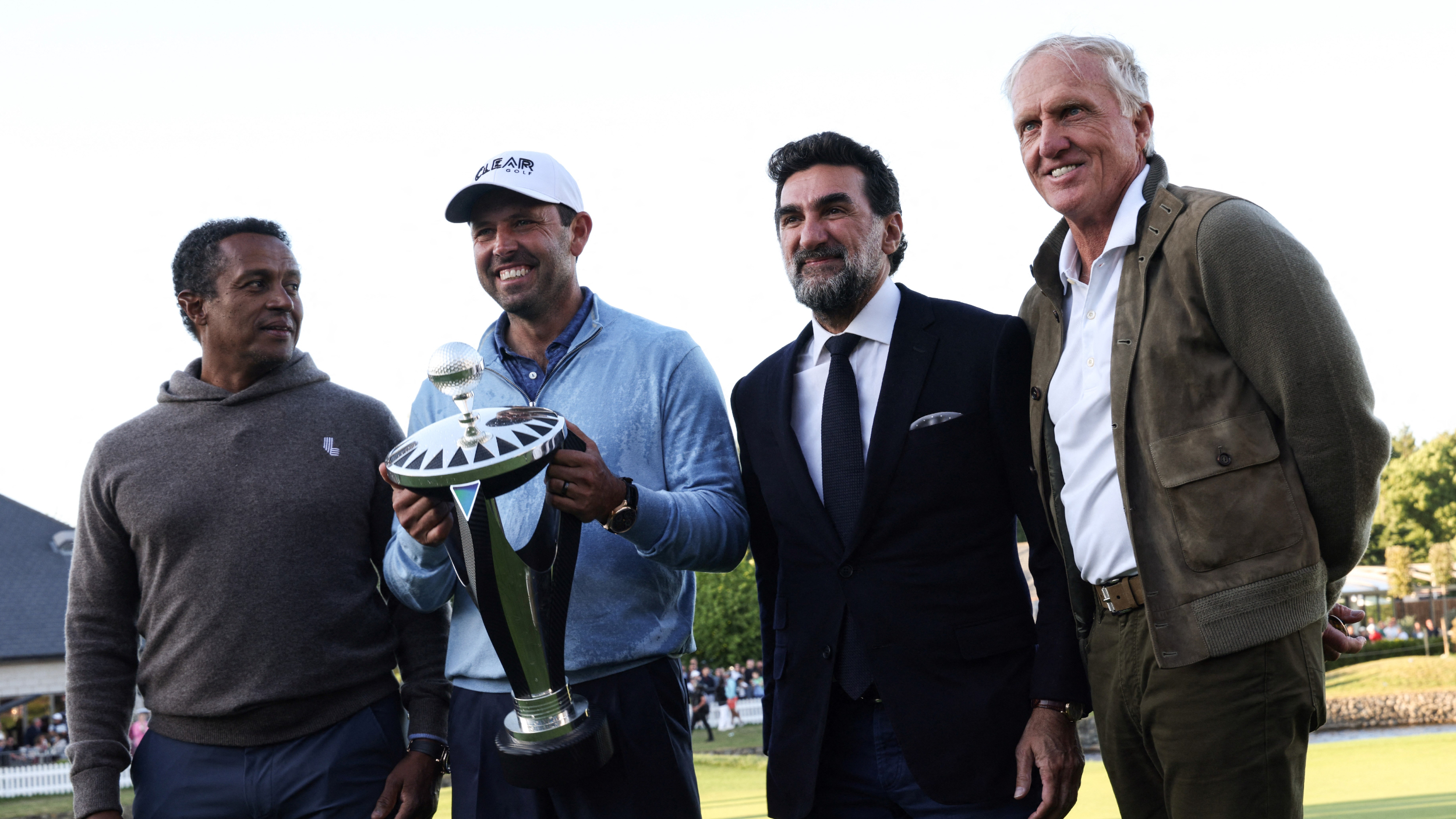 Charl Schwartzel and LIV Golf officials with the LIV Golf London trophy