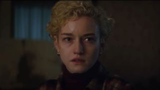 Julia Garner looks concerned in Wolf Man