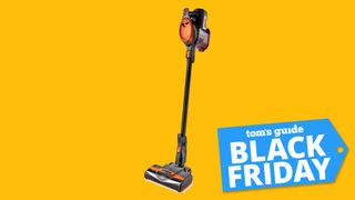 Product shot of the Shark Rocket stick vacuum cleaner against a yellow background with a Black Friday tag.
