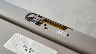 A photo of the Logitech Pop Keys keyboard battery compartment