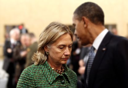 Hillary Clinton speaks with President Obama in 2010.