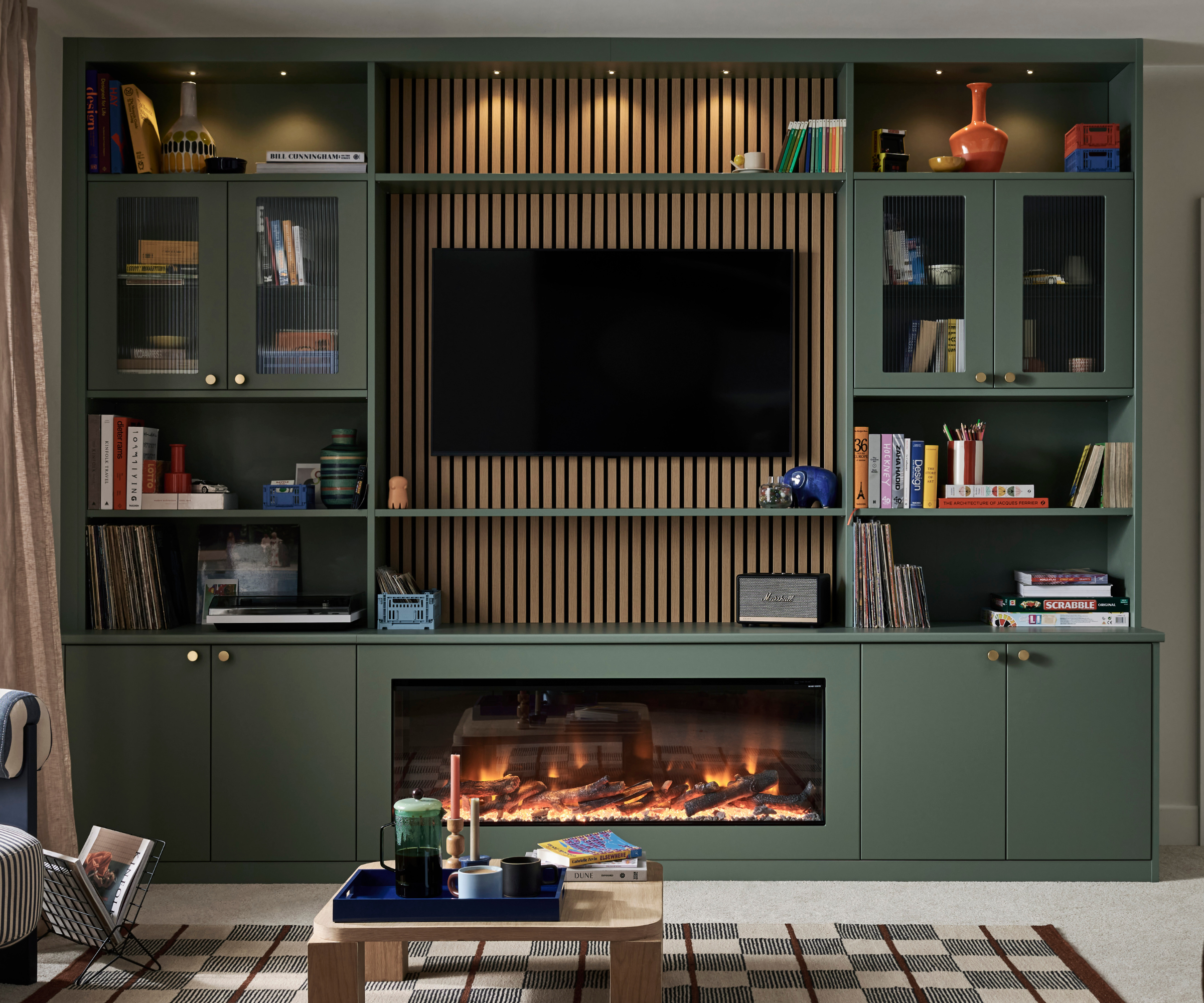 Media wall with panelling behind the tv and above fireplace