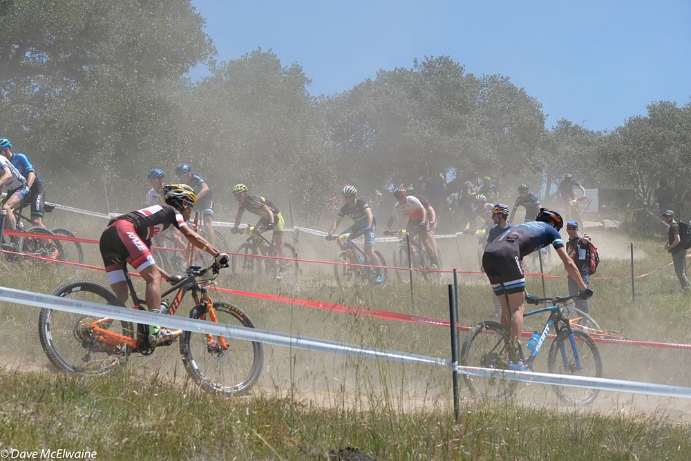 Riders descending switchbacks during the first lap