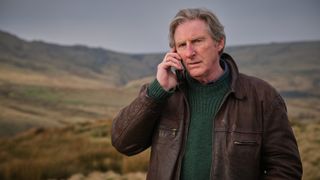 Adrian Dunbar on the phone in ITV's Ridley.