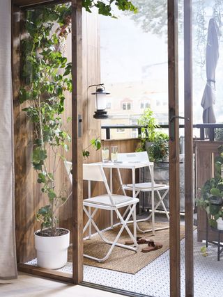 Balcony with plants and folding Ikea furniture