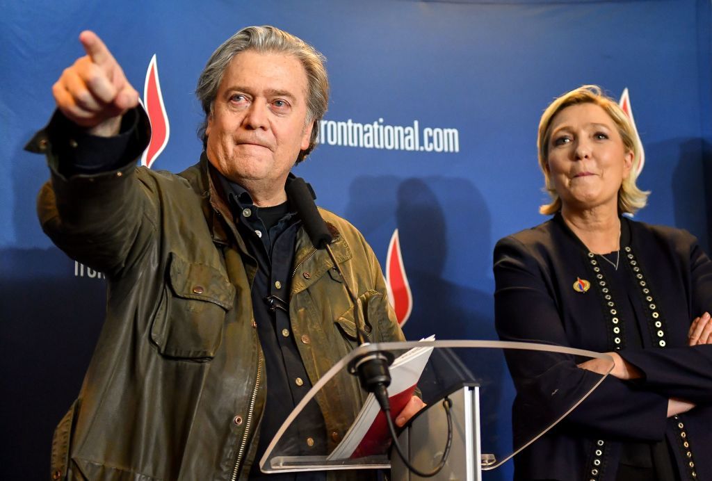 Stephen Bannon (L) gestures as he stands next to France&amp;#039;s far-right party Front National (FN) president Marine Le Pen