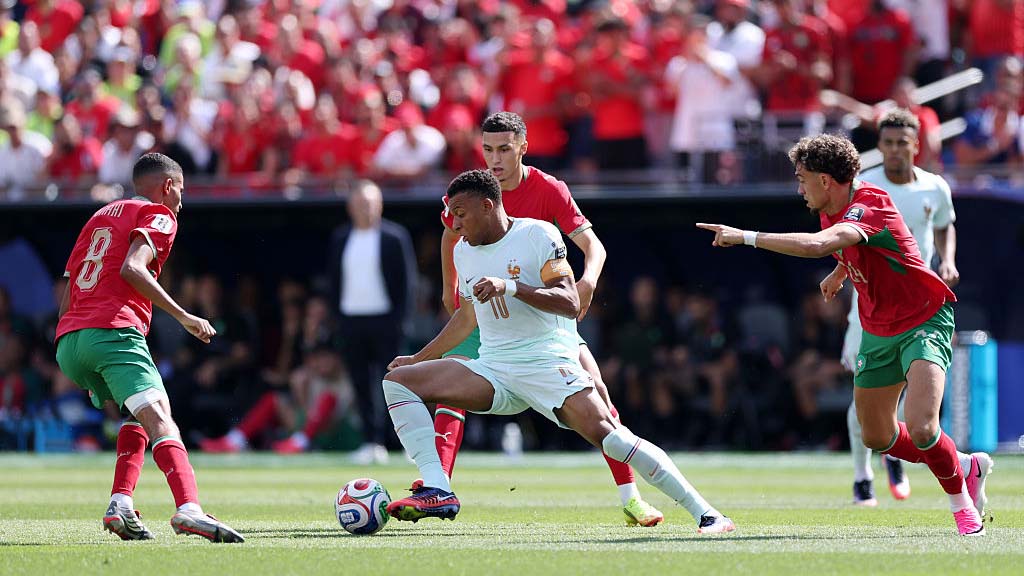 FOXBOROUGH, MASSACHUSETTS - JULY 09: Kylian Mbappe #10 of France controls the ball against Azzedine Ounahi #8, Bilal El Khannouss #23 and Neil El Aynaoui #24 of Morocco during the FIFA World Cup 2026 Quarter Final match between France and Morocco at Boston Stadium on July 09, 2026 in Foxborough, Massachusetts. (Photo by Kevin C. Cox/Getty Images)