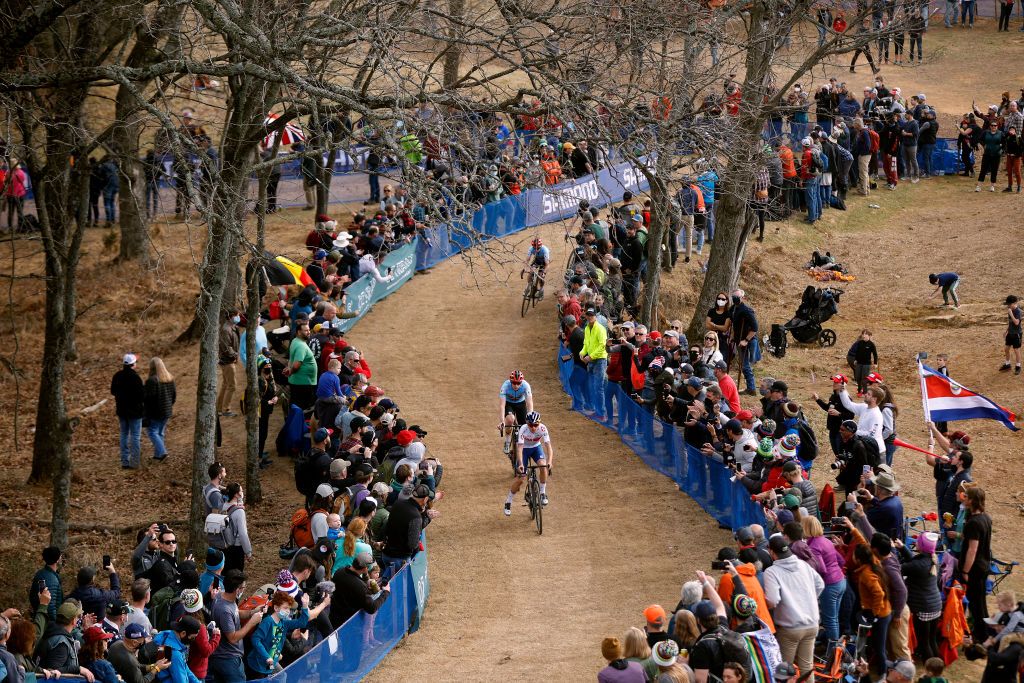 FAYETTEVILLE ARKANSAS JANUARY 30 A general view of Thomas Pidcock of The United Kingdom and Michael Vanthourenhout of Belgium compete on the circuit while fans cheer during the 73rd UCI CycloCross World Championships Fayetteville 2022 Mens Elite Fayetteville2022 on January 30 2022 in Fayetteville Arkansas Photo by Chris GraythenGetty Images