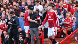 Manchester United head coach / manager Ruben Amorim embraces Harry Maguire of Manchester United as he comes off during the Premier League match between Manchester United FC and Manchester City FC at Old Trafford on April 6, 2025 in Manchester, England.
