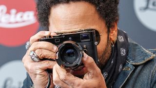 Lenny Kravitz takes a picture during the vernissage 'Flash by Lenny Kravitz' on June 23, 2015 in Wetzlar, Germany.