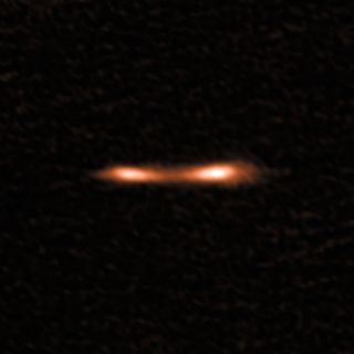 This ALMA image shows the Cosmic Eyelash, a distant starburst galaxy.