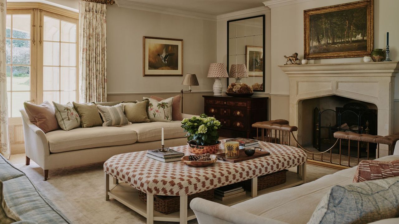 neutral traditional country living room with a large upholstered ottoman