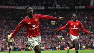 Kobbie Mainoo of Manchester United celebrates after scoring his team's third goal during the Premier League match between Manchester United and Liverpool at Old Trafford. 