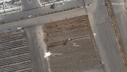 An image from Maxar's WorldView-3 satellite shows the Behesht-e Masoumeh cemetery in Qom, Iran, on March 1, 2020. The cemetery is preparing for the pandemic by digging two long "trenches" of graves, each about 100 yards (90 meters) long.