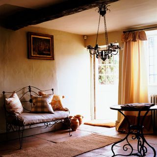 living room with tiled flooring and white window with curtains