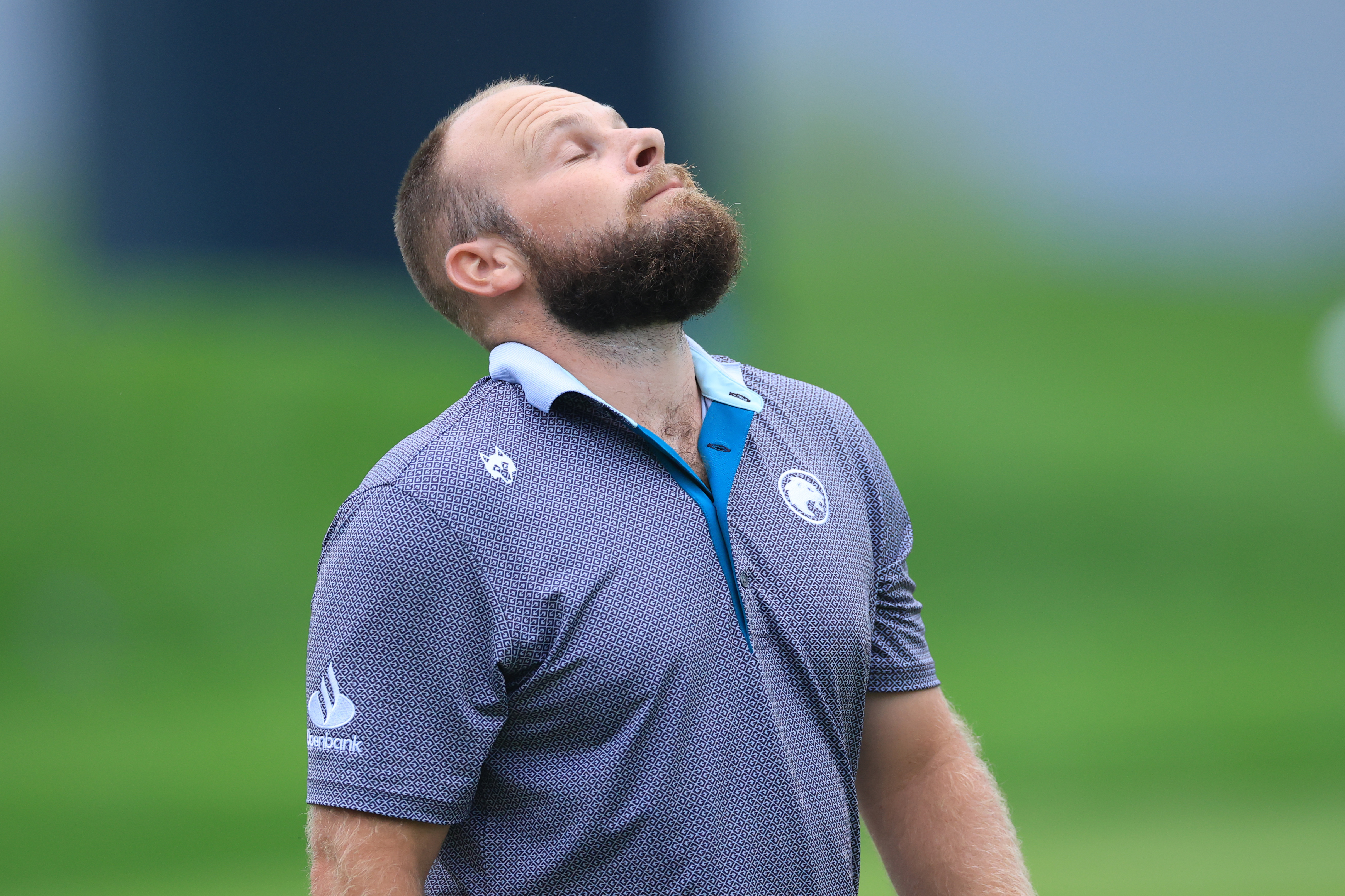 Tyrrell Hatton looks up to the sky