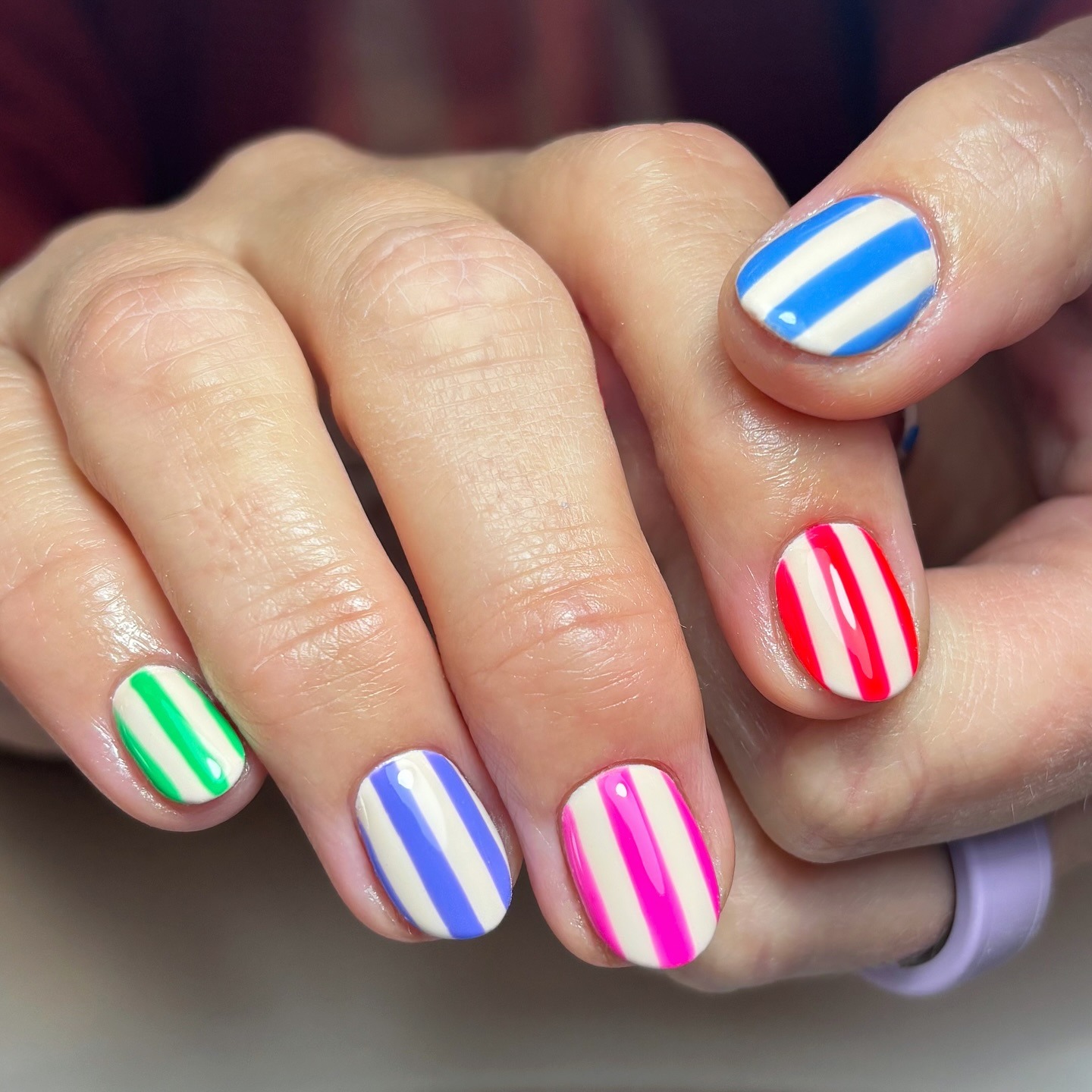 Multicolored nautical striped nails.