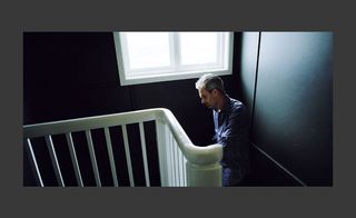 A man standing on the staircase