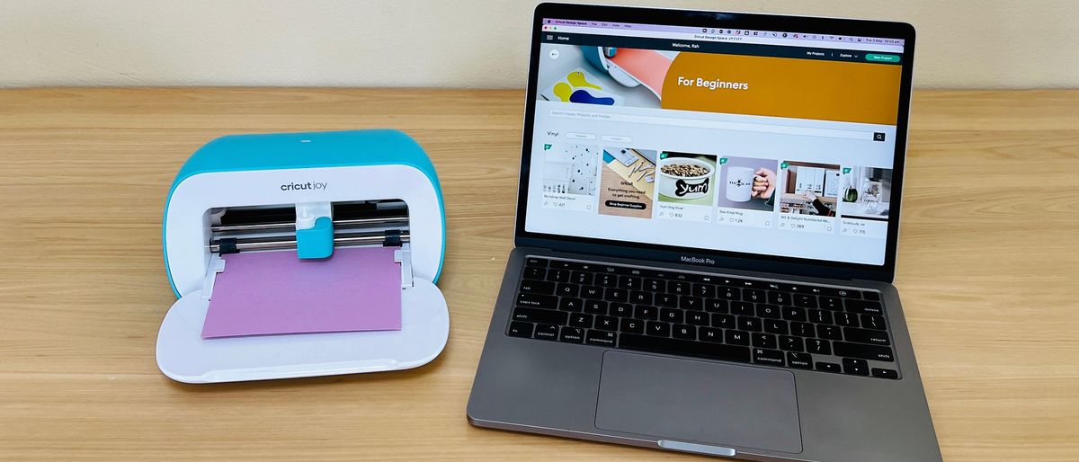 Cricut Joy beside a laptop with the desktop app