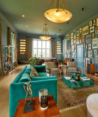 Eclectic living room with blue paint and a gallery wall