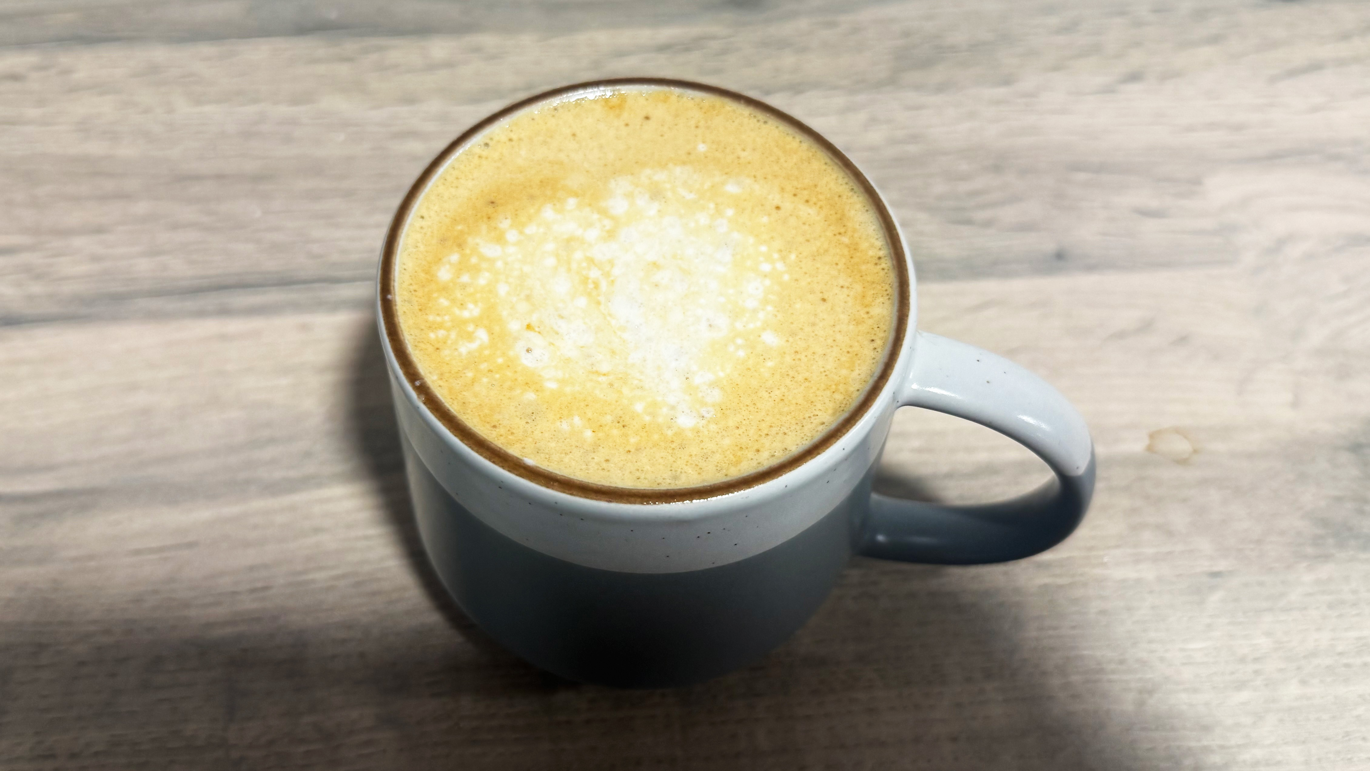 a photo of a latte made on the gevi espreso machine with grinder