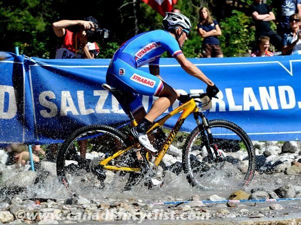 Jaroslav Kulhavy (Czech) races through the water crossing