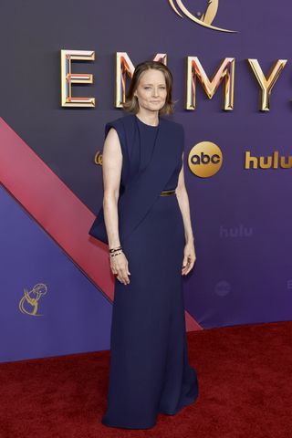 Jodie Foster wears a navy custom Louis Vuitton gown.