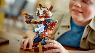 A completed Lego Marvel Rocket and Baby Groot being played with