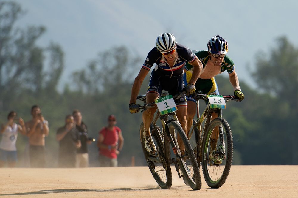 Julien Absalon of France sprints ahead of Henrique Avancini of Brazil