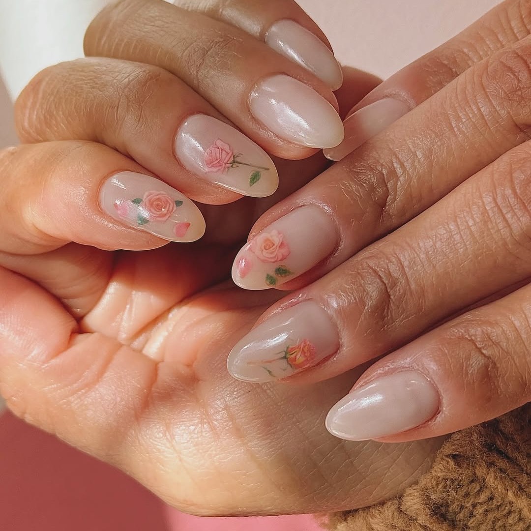 A nude manicure with pretty floral art.