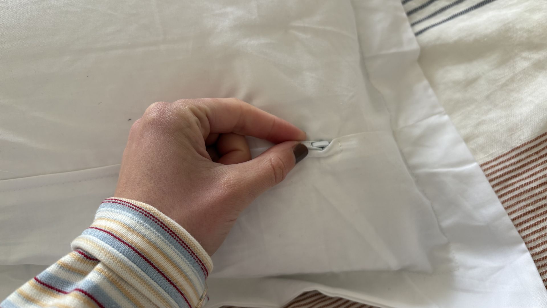 Testing the Eli &amp;amp; Elm Ultimate Side Sleeper Pillow, showing it on the bed