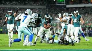 Saquon Barkley of the Philadelphia Eagles scoring a touchdown against the Dallas Cowboys