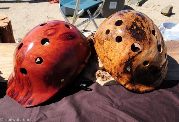 Custom wooden helmets on display by Coyle Tree Piece Helmets