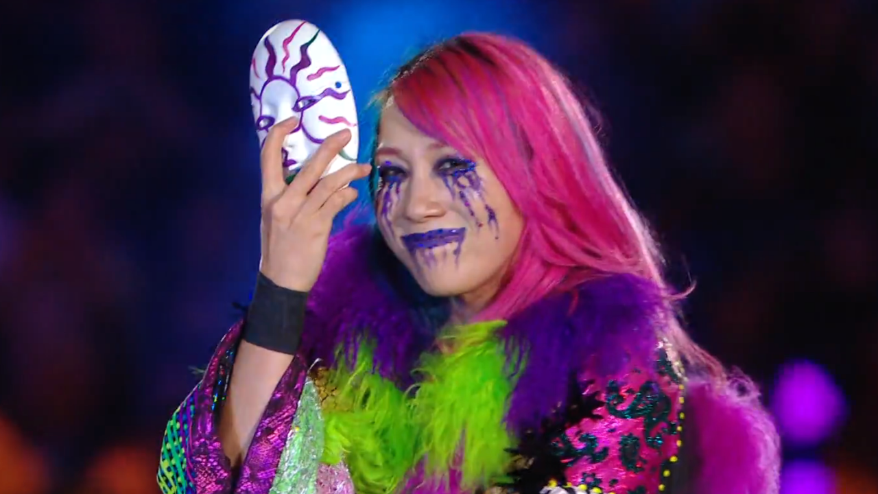 Asuka takes off her mask to reveal a painted face.