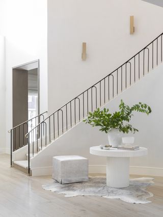 a modern entryway with a side table