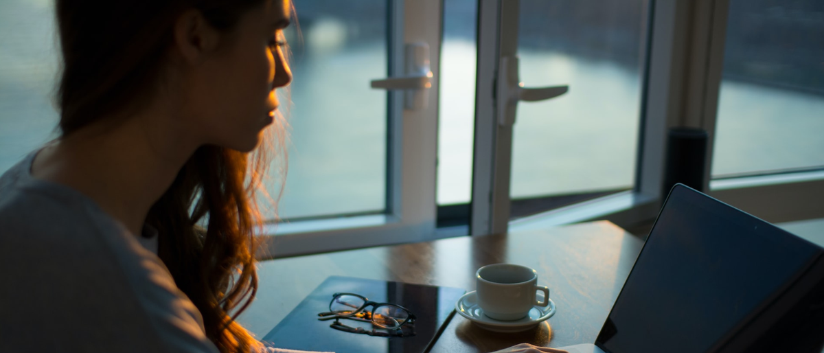 Woman in a cafe using a laptop