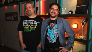 Matt Dinniman and Jeff Hays promote Dungeon Crawler Carl series in franchise t-shirts.