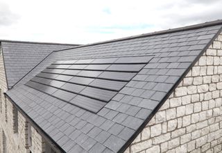 solar tiles installed of slate house roof