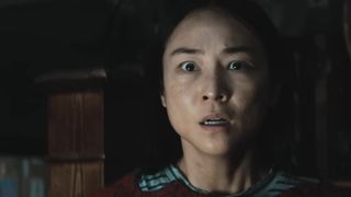 Greta Lee's Riley looking terrified in The Last House.