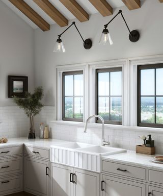 white kitchen with antique brass wall sconces by Lights.com