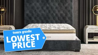 Saatva mattress sales and deals image shows the Saatva Solaire mattress on a luxury black bedframe with button headboard and a lowest price sales badge overlaid in blue